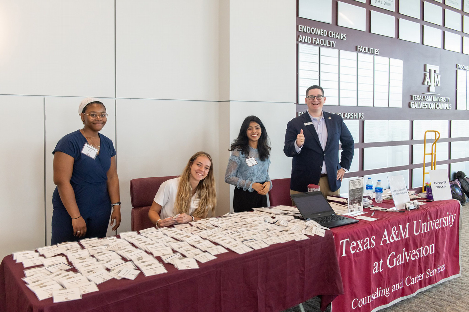 Texas A&M University at Galveston students volunteering at the check in table. 