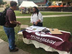 Richard Dally of the TAMUG Archaeology Research Group speaking with a potential member.