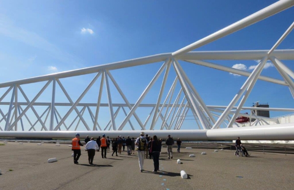 Dwarfed by its immense size, a group of Texas A&M University at Galveston students, staff, faculty, Texas politicians and concerned citizens go on a tour of the Netherlands Maeslant Barrier. 