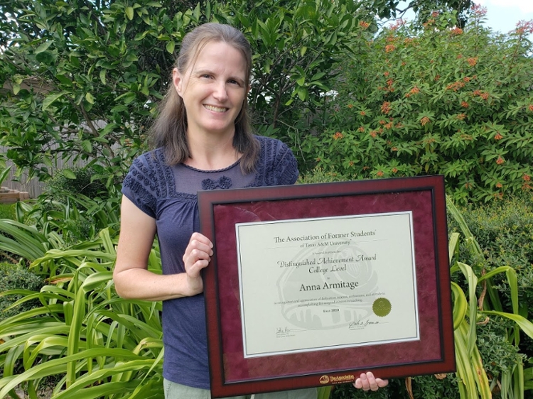 Department of Marine Biology Professor Dr. Anna Armitage poses with her Association of Former Students Distinguished College-Level Teaching Award.