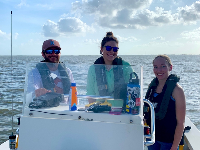 Members of the Gulf Center for Sea Turtle Research team pose on a boat during a recent excursion.