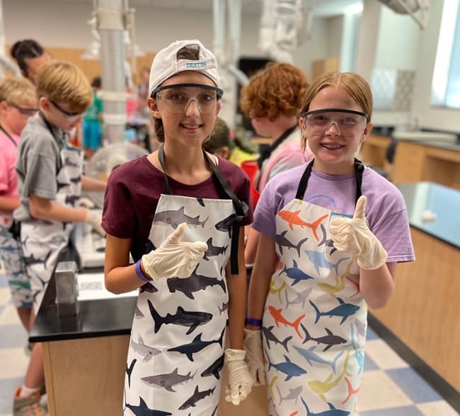 Sharks & More campers pose for a quick photo during a shark dissection activity in a lab on the Galveston Campus. 