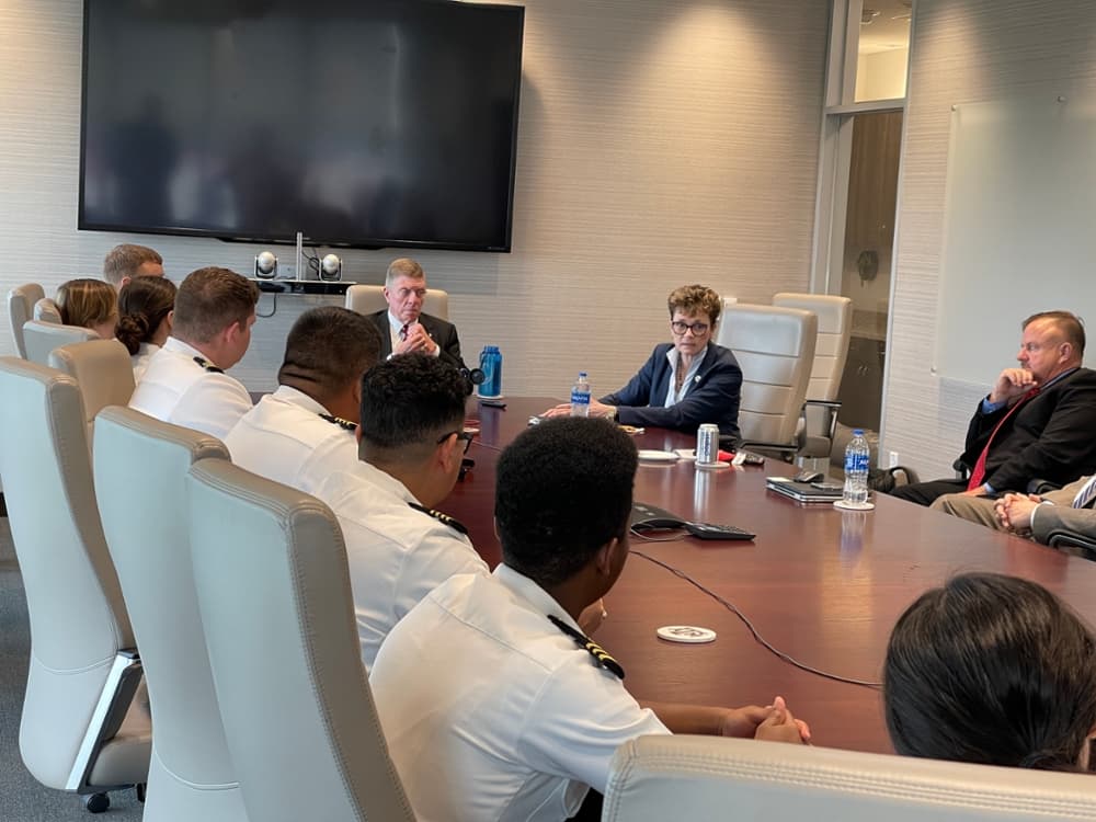 Students and administrators meeting with RAdm Ann Phillips